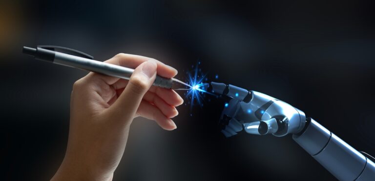 A human hand holding a pen receives it from a robotic hand, with a glowing blue light at the point of contact, symbolizing collaboration between humans and AI.